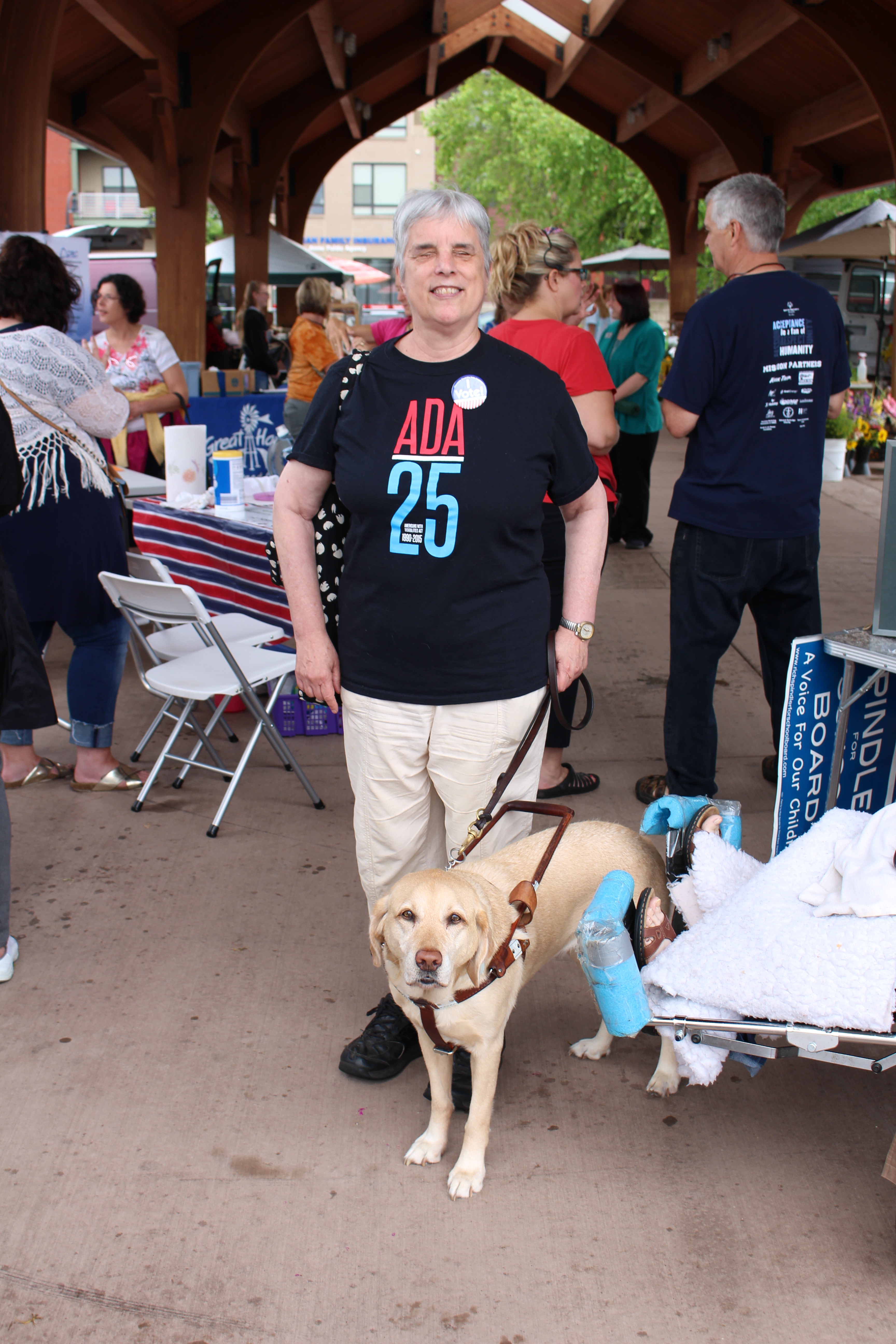 Katherine Schneider and her guide dog at the celebration of the 27th Anniversary of the Americans with Disabilities Act